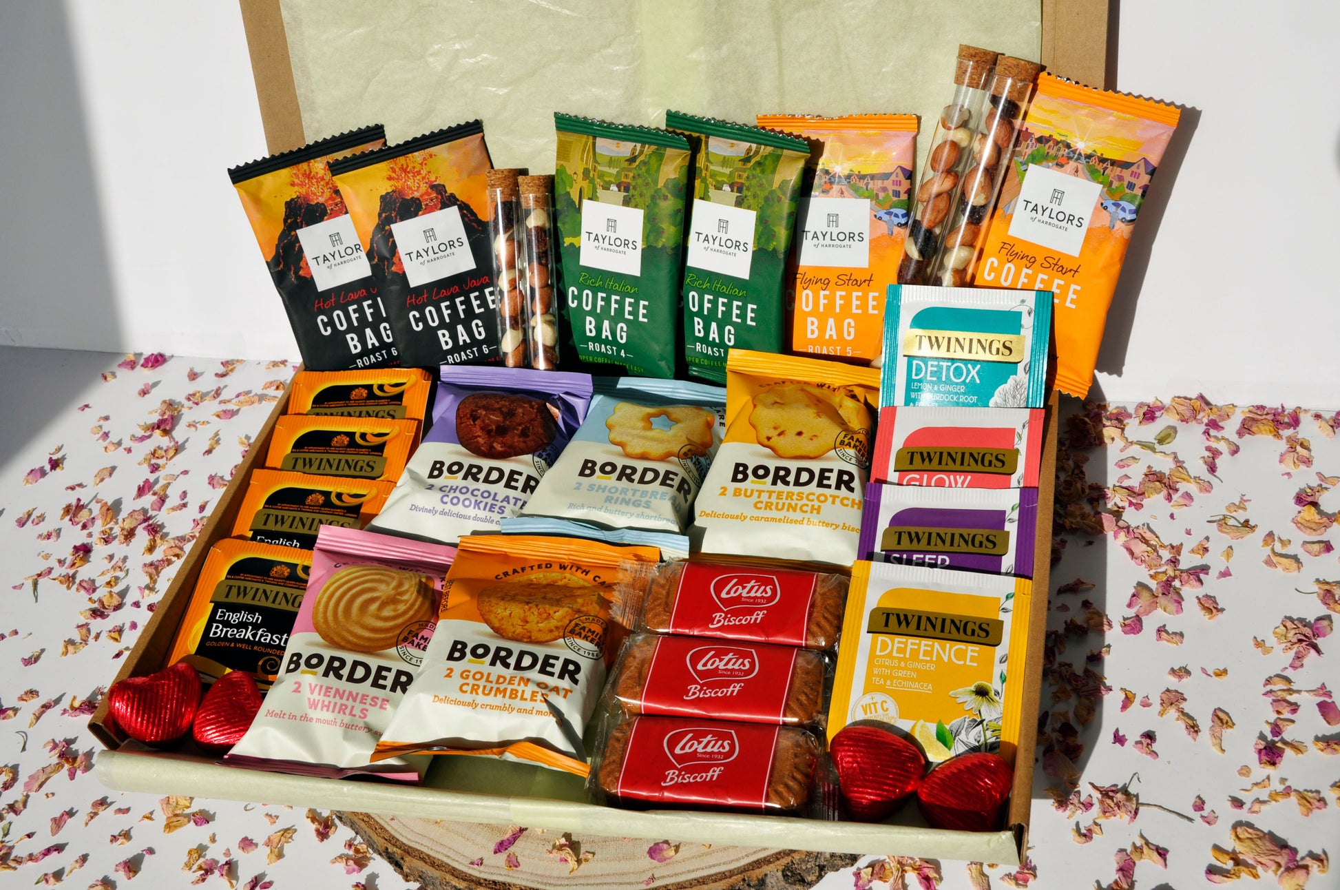 Large letterbox containing 6x Taylor's coffee boxes (2 of each types of roast) 4x Tubes of Fruit and Nut mix (2 small and 2 large) 5x Border Biscuits mini packs (will try to add one of each flavour, unless requested otherwise) 4x Twinings breakfast teas 4x Twinings herbal teas 3x Lotus Biscoff Biscuits 4x Heart Chocolates