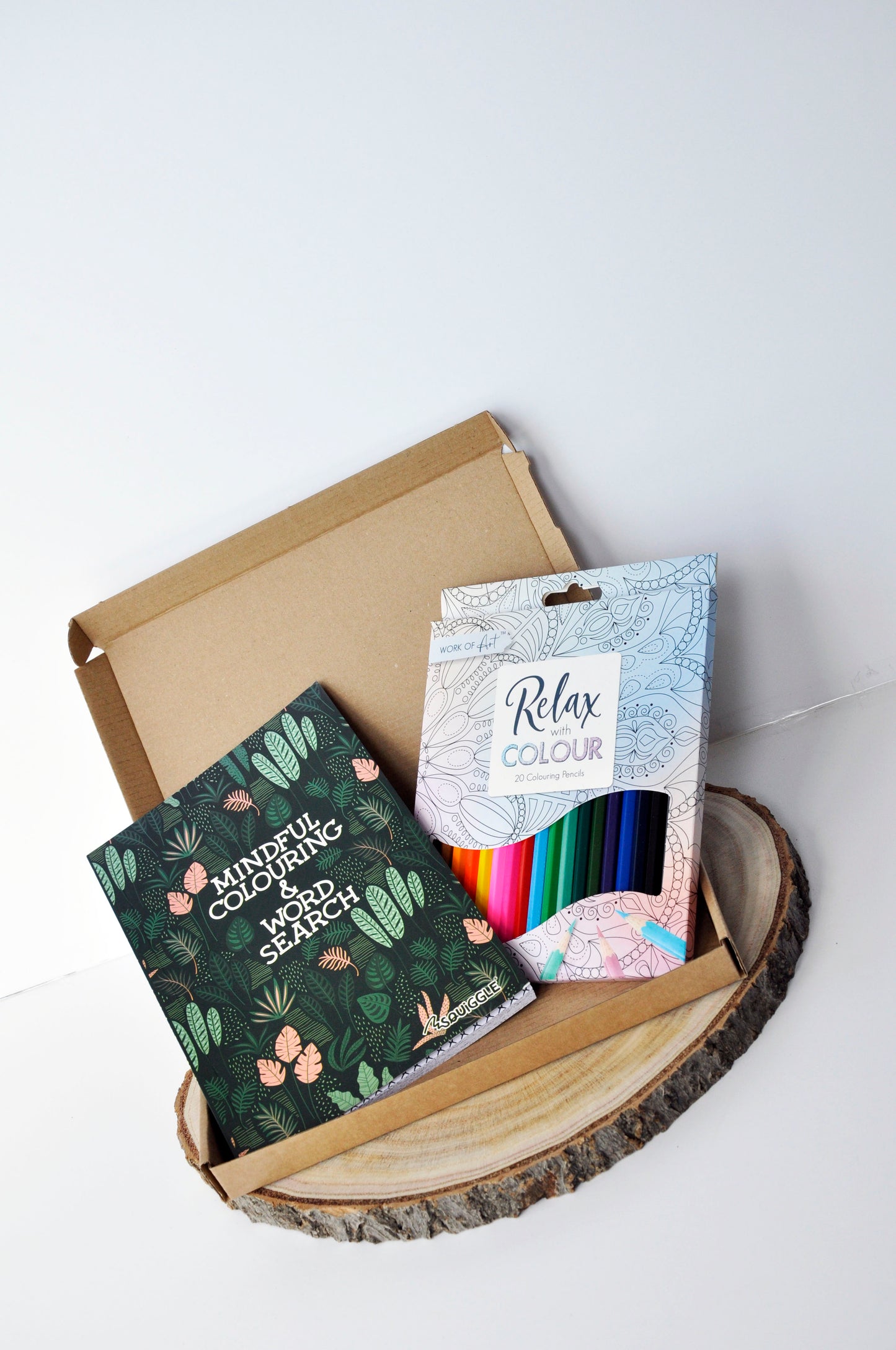 medium letterbox box showing 1 mindful colouring and word search book in green and 1 set of 20 colouring pencils